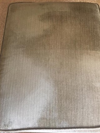 dirty upholstery cushion with stains in a merced ca home